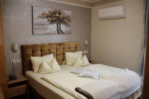 Krevet ili kreveti u jedinici u okviru objekta Hotel Lang