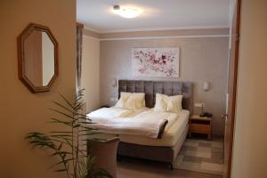 Krevet ili kreveti u jedinici u okviru objekta Hotel Lang