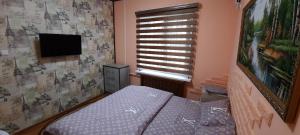 Een bed of bedden in een kamer bij City HOSTEL ELDORADO