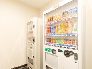 a vending machine filled with lots of drinks at Tabist Sunshine Koga in Koga