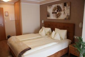 Krevet ili kreveti u jedinici u okviru objekta Hotel Lang