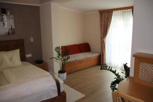 Krevet ili kreveti u jedinici u okviru objekta Hotel Lang