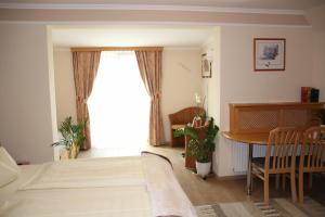 Krevet ili kreveti u jedinici u okviru objekta Hotel Lang