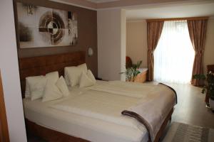 Krevet ili kreveti u jedinici u okviru objekta Hotel Lang