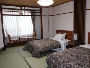 Postel nebo postele na pokoji v ubytování HESTA Hakone - GUEST HOUSE -