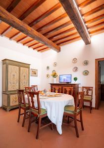 a dining room with a table and chairs at Portion of Villa with Private pool in Vaglia