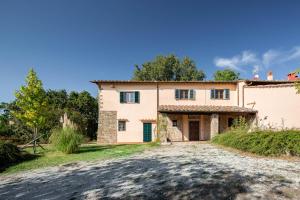 an external view of a large house with a driveway at Portion of Villa with Private pool in Vaglia