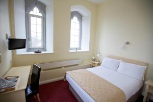 Postel nebo postele na pokoji v ubytování Maynooth Campus Accommodation