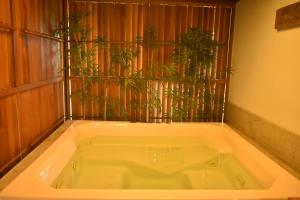 a bath tub with a plant in it at Kumarakom Lake Resort in Kumarakom