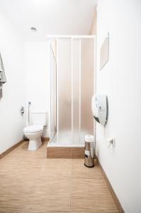 a bathroom with a shower stall and a toilet at Apartment in the center of Warsaw in Warsaw