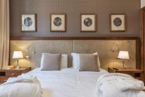 A bed or beds in a room at 900 Apartments Lazio, Emilia & La Corte