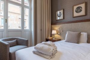 A bed or beds in a room at 900 Apartments Lazio, Emilia & La Corte