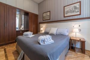 A bed or beds in a room at 900 Apartments Lazio, Emilia & La Corte