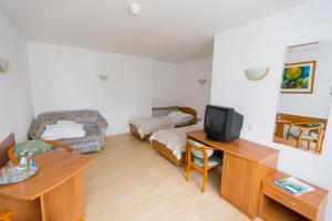 Łóżko lub łóżka w pokoju w obiekcie Geovita Zakopane