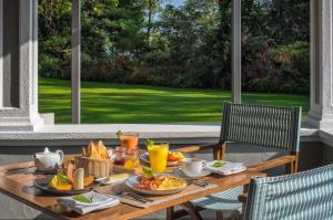 a table with food and drinks on a patio at Nine Skies in Ella