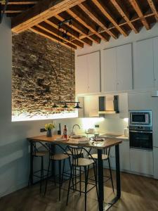 a kitchen with a table and chairs in a room at Casa Blanca in Málaga