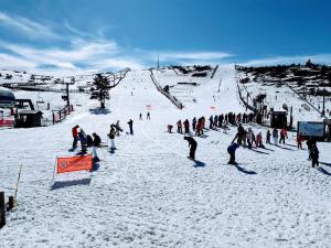 a group of people on a snow covered ski slope at Barranco de las Maravillas in Teruel