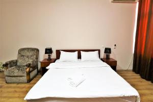 Postel nebo postele na pokoji v ubytování Ortachala Palace