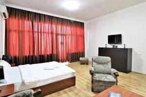 Postel nebo postele na pokoji v ubytování Ortachala Palace