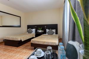 Ένα ή περισσότερα κρεβάτια σε δωμάτιο στο Technopark Hotel
