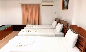 Tempat tidur dalam kamar di Golden Bee PhiPhi
