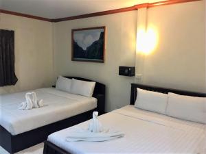 Tempat tidur dalam kamar di Golden Bee PhiPhi