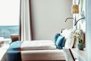 Posteľ alebo postele v izbe v ubytovaní La Maiena Meran Resort