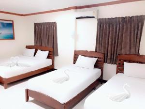 Tempat tidur dalam kamar di Golden Bee PhiPhi