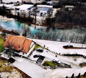 an aerial view of a house next to a river at Pansion Neretva in Konjic