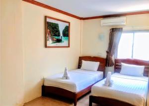 Tempat tidur dalam kamar di Golden Bee PhiPhi