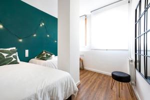 Posteľ alebo postele v izbe v ubytovaní Glam Penthouse Barcelona