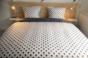 Ένα ή περισσότερα κρεβάτια σε δωμάτιο στο Appartement design tout confort (parking gratuit)