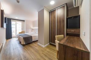 Postel nebo postele na pokoji v ubytování Hotel Rosaleda del Mijares