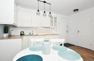 Kuchnia lub aneks kuchenny w obiekcie Apartament "Bliżej Morza 30"