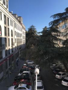 a row of cars parked in a parking lot at Le Petit in Tbilisi City