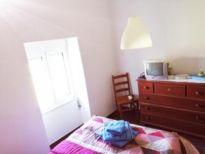 Giường trong phòng chung tại Casa dos Pisoeiros Montemuro/Douro