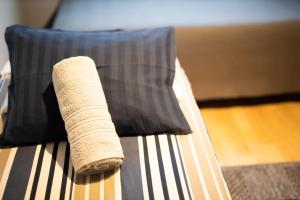 a roll of paper sitting on top of a bed at Two-Room Apartment Turku City Center in Turku