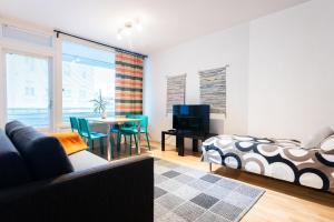 a living room with a couch and a table at Two-Room Apartment Turku City Center in Turku