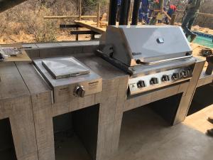 a barbecue grill sitting on top of a table at Kgorogoro Lodge in Pilanesberg