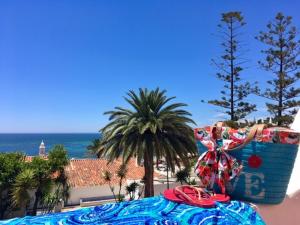 a view of the ocean from a resort with a table at Apartamentos Borda D´Agua in Albufeira