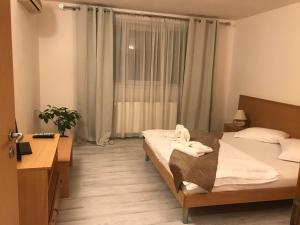 Кровать или кровати в номере Hotel Vandia