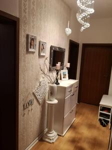 a room with a vanity with a mirror and a dresser at BS Business Travelling in Hannover