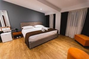 Postel nebo postele na pokoji v ubytování Olivar Hotel Tirana
