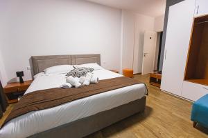 Postel nebo postele na pokoji v ubytování Olivar Hotel Tirana