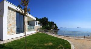 a house with a view of the ocean at Maistra Select Mlini Villas and Apartments in Mlini