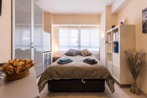 Posteľ alebo postele v izbe v ubytovaní La Casita Malagueta