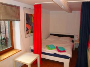 En eller flere senge i et værelse på Maison de vacances Alsace - Ferienhaus Elsaß - Holiday house Alsace