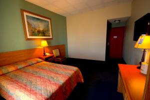 Postel nebo postele na pokoji v ubytování Hotel Consulado Inn