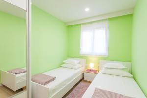 Ένα ή περισσότερα κρεβάτια σε δωμάτιο στο CENTER NEW APARTMENT KRIVIC