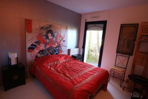 Postel nebo postele na pokoji v ubytování Hôtel Ilargi